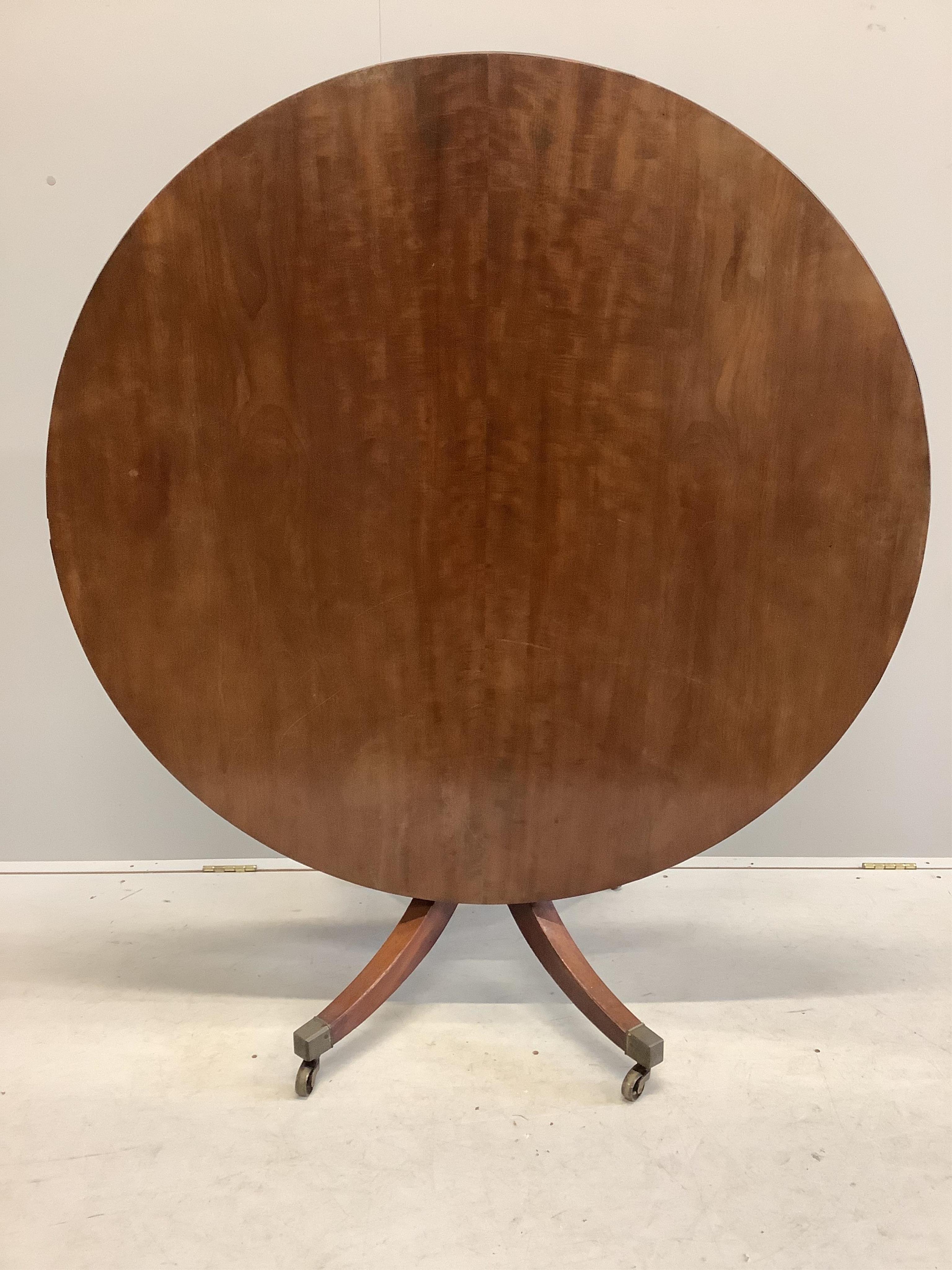 A George III circular mahogany tilt top breakfast table, diameter 120cm, height 71cm. Condition - fair to good